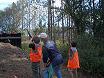 Jules Vignutti smokes a target as brother Ahnea looks on.